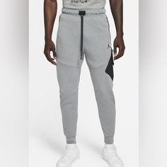 New With Tags Gray Athleisure Trousers, Urban Gray Sports Bottoms, Gray Sportswear Joggers, Gray Urban Sport Bottoms, Urban Gray Bottoms For Sports, Sporty Heather Grey Bottoms With Pockets, Sporty Gray Bottoms With Hip Pockets, Gray Tapered Leg Sports Pants, Sporty Gray Tapered Leg Pants