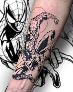 a man with a spiderman tattoo on his arm