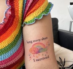 a woman's arm with a tattoo saying, long story short i survived