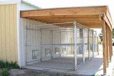 a dog kennel in the middle of a yard