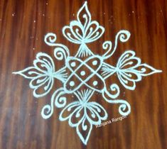 an intricately designed design on a wooden table