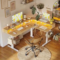 a home office with two desks and a chair in the middle of the room