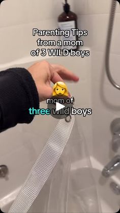 a person holding a yellow object in front of a bathtub with the words, parenting tips from a mom of 3 wild boys