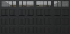 a black garage door with four windows