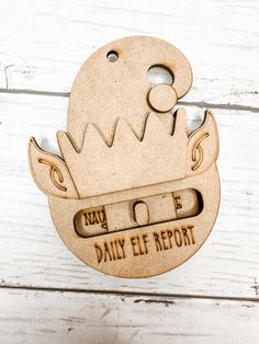 a wooden ornament that says daily elf report