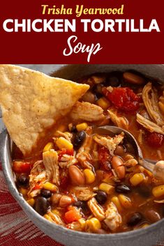 a bowl of southwestern chicken soup with tortilla chips