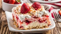 a close up of a slice of cake on a plate with strawberries in the background