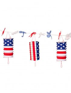 american flags and birds hanging from clothes pins on a line with paper lanterns in the shape of usa's flag