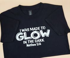 "I WAS MADE TO GLOW IN THE DARK" "Matthew 5:14" unisex Youth/kids T-shirt, church youth/kids T-Shirt, Jesus kids "I WAS MADE TO GLOW IN THE DARK" "MATTHEW 5:14" ITEM DETAILS: Softstyle Youth Unisex T-Shirt 🤍4.5 oz., 100% ring spun cotton 🤍Taped neck and shoulders for comfort and durability 🤍Tubular body (side seam on size small), Modern classic fit 🤍Rib collar HOW TO ORDER: 1. Choose your size from the drop-down menu. 2. Click Add to cart. 3. Click checkout. (Please make sure the address on your order is correct.) CARE INSTRUCTIONS: *Machine wash cold, inside out *Tumble dry low heat, inside out *Do not iron over the design.  *Do not dry clean. T-shirts are made to order once you make your purchase. Order processing typically takes 5-7 business days once payment is received. That can f Ministry Fair, Jesus Kids, Fall Family Fun, Youth Games, Church Youth, Matthew 5, Family Fun Night, Dark Outfits, Jesus Shirt