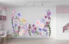 a room with flowers painted on the wall