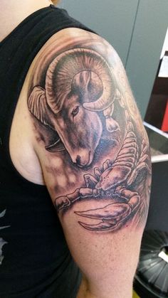 a man with a goat tattoo on his arm