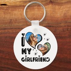 i love my girlfriend keychain with two photos on it and the words'i love my girlfriend '