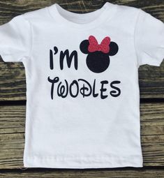 a t - shirt that says i'm toodles with minnie mouse ears on it