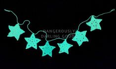 green star string lights on a black background