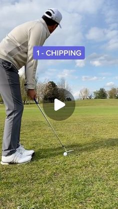 a man hitting a golf ball with a club in his hand and the words 1 - chipping above it