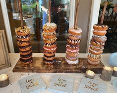 a table topped with donuts covered in frosting