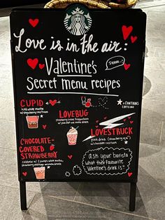 a sign advertising love is in the air and valentine's secret menus on it