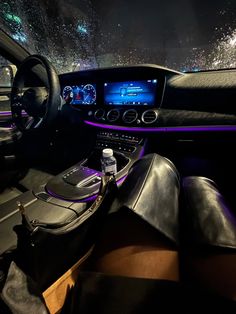 the interior of a car with lights on