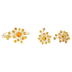 Dandelion Flower set: ring and earrings with yellow sapphires and diamonds Earrings: Metal: 14 karat gold Weight: 2 g. Size: 15 x 12.4 mm. Central stones: Genuine sapphires Cut: Round cabochon Weight: approx 0.60 ct. Color: Yellow Clarity: Transparent with inclusions Sapphires: round cut, yellow-to orange color, transparent, weight - 0.04 ct x 26 = 1.04 ct total. Ring Weight: 2.2 g. (depends from size) Gold - 14 karat gold Central stone: Genuine sapphire Cut: Round cabochon Weight: approx 0.30 c Cheap Yellow Flower-shaped Jewelry, Yellow Dandelion, Diamonds Earrings, Sapphire And Diamond Earrings, Vintage Cocktail Ring, Dandelion Flower, Earrings Metal, Set Ring, Modern Earrings