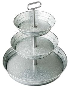 three tiered cake pans stacked on top of each other