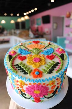 a decorated cake sitting on top of a white plate