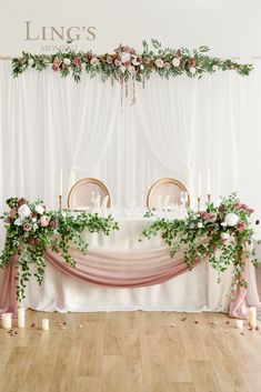 the table is decorated with greenery and candles for an elegant touch to the wedding reception