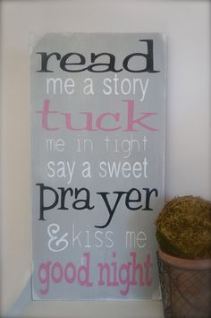 a teddy bear sitting on top of a shelf next to a sign that says, me a story tuck me in tight say a sweet prayer