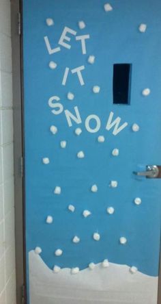 a door decorated with snow and the words let it snow