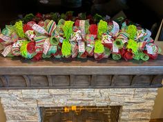 a fireplace with christmas decorations on it