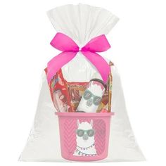 a pink basket filled with lots of candy