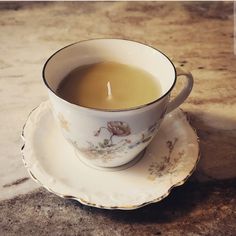 a cup of tea sitting on top of a saucer