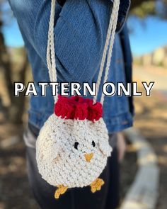 a crocheted chicken bag hanging from the back of someone's jeans