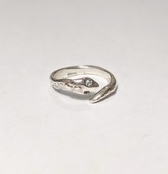 "Handmade solid sterling silver ring, an artisan jewel with organic shapes with a unique texture, made to measure with a unisex design.  This model is adjustable, so no problem with the size! (But if you know it, write it on the notes so I can be more accurate Each ring is handmade and therefore will always be a unique piece.  You can choose the wide band (\"fascia larga\", height 6-7 mm/ 0.23 Inches) or tight band (\"fedina\", height 3-4 mm/0.11 Inches) version, and also the size. If you don't know your size or you prefer a more versatile ring I suggest to choose the \"adjustable\" option :-) Made in Italy, with gift box included  Lost wax technique originally introduced in the Bronze Age and which over the centuries has experienced a notable flowering, especially in Greek and Roman art a Unique Sterling Silver Open Band Rings, Minimalist Adjustable Sterling Silver Engraved Ring, Unique Sterling Silver Snake Ring As Gift, Unique Hand Cast Sterling Silver Engraved Ring, Sterling Silver Open Snake Ring Gift, Adjustable Sterling Silver Engraved Ring, Nickel Free, Adjustable Nickel Free Sterling Silver Engraved Ring, Adjustable Nickel-free Sterling Silver Engraved Ring, Unique Hand Cast Snake Ring As Gift