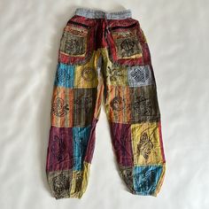 Not Sure How To Even Describe These Unique Pants! 100% Cotton. Striped Colorful Pants With Lots Of Various Graphics And Symbols. Peace Sign, Sunshine, Spirals, Ethnic. Nwt. Size Small. Zipper And Front Velcro Pockets! Bin 1 Hippie Multicolor Relaxed Fit Pants, Multicolor Relaxed Fit Hippie Pants, Hippie Style Multicolor Relaxed Fit Pants, Yellow Ankle-length Harem Pants With Pockets, Multicolor Patchwork Pants For Loungewear, Multicolor Relaxed Fit Hippie Bottoms, Relaxed Fit Multicolor Hippie Bottoms, Colorful Cotton Wide Leg Pants, Colorful Wide Leg Cotton Pants