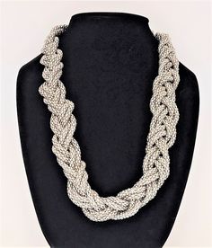 Byzantine braided double strand necklace in silver colour with a twist Beautiful necklace in silver - no closure fits over head easily Great gift or look for your next get together. FREE SHIPPING Adjustable Double Strand Silver Chain Necklace, Silver Multi-strand Costume Jewelry, Elegant Silver Necklace With Rope Chain, Elegant Silver Rope Chain Necklace, Elegant Braided Silver Jewelry, Elegant Silver Braided Jewelry, Silver Double Strand Necklace With Sterling Clasp, Silver Twisted Metal Jewelry, Silver Double Strand Costume Necklace