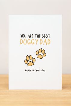 you are the best doggy dad card with dog paw prints on it and text that reads, you are the best doggy dad happy father's day