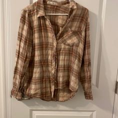 Size Small Long Sleeve Button Up Flannel. Brown/Khaki Colors. Perfect For Fall. One Chest Pocket. Buttons On Sleeves To Cuff. Very Soft And Comfortable. Never Worn. Beige Casual Button-up Flannel Shirt, Casual Beige Button-up Flannel Shirt, Beige Button Closure Shirt For Fall, Khaki Color, Plaid Flannel, Tan Brown, Chest Pocket, Button Down Shirt, Button Up