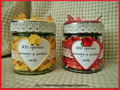 two jars filled with hearts and flowers on top of a table next to each other