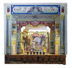 an elaborately painted stage with people and animals