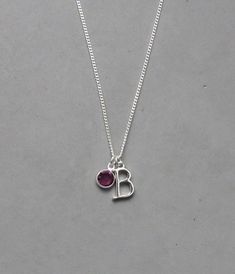 The initial is silver plated and measures 10 mm x 15 mm. It is strung on a silver plated tiny 1.3 mm curb chain with a lobster clasp closure. Choose the length from the drop down. To add a birthstone charm to this necklace, follow link below to purchase the charm. https://www.etsy.com/listing/634099372/add-a-birthstone-charm?ga_search_query=add&ref=shop_items_search_1 January Stone, B Necklace, Initial B, Birthstone Gems, Everyday Necklace, Birthstone Charms, Name Necklace, Charm Necklace, Birthstone