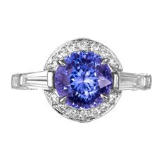 Cornflower blue sapphire and diamond three-stone engagement ring by classic designer, Krementz. 3.57ct cornflower blue round Sapphire center stone. Mounted in a Platinum setting, accented with a baguette diamond on each side of the stone as well as a halo of round cut diamonds. The crown, shoulders and both sides of the shank are adorned with round cut diamonds. Truly and sensational piece. The sapphire is GIA certified as natural, no heat no enhancements. Krementz & Co was founded by George Kre Cornflower Blue Sapphire, Platinum Diamond Ring, Platinum Diamond Engagement Rings, Round Sapphire, Platinum Diamond Rings, Three Stone Engagement, Platinum Engagement Rings, Baguette Cut Diamond, Three Stone Engagement Rings