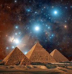 the great pyramids of giza are surrounded by stars