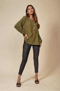 Get ready to shine and make a bold fashion statement with this glamorous and stylish top. This layered top combines comfort and glamour in an effortlessly chic way, perfect for both casual and dressy occasions! And also it comes with a matching necklace! SPECS: Material: Viscose Color: Khaki Fit: Relaxed Size: Oversized Sleeve: Long Product Highlight: ● Oversized fit with details. ●Long sleeves for added elegance. ● Versatile design. ● Lightweight fabric for summer and spring. ● Suitable for var