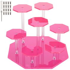 three pink hexagonal tables are shown with screws and studs on them