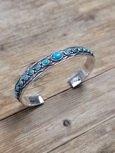 10 mm Turquoise cuff bangle  Dimensions   L X W   7.5 inch x 10 mm  All our Silver Jewelry are 925 stamped and 92.5% Pure Sterling silver. We do not use Nickel.  The stones used in our Jewelry are all Natural Gemstones  💎. The item listed in the page is the actual item for sale. We have listed the dimensions of the Jewelry in item details. If you should require any other specific dimensions, please message us . 📦Shipping & Exchange of items ----------------------------------------------- 30 Da Turquoise Sterling Silver Bohemian Bangle, Bohemian Turquoise Sterling Silver Bangle, Bohemian Blue Sterling Silver Bangle, Sterling Silver Bangle, Turquoise Cuff, Jewelry Boho, Sterling Silver Bangles, Silver Bangle, Cuff Bangles