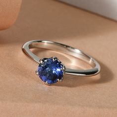 a blue ring sitting on top of a table