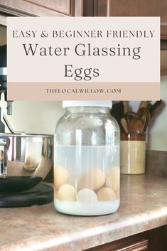 a glass jar filled with eggs sitting on top of a counter