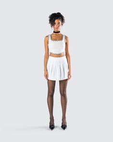 Add a little prep to your step in this two-piece set 💅 Featuring an ivory tweed bustier top and a white pleated tennis skirt - this fit is giving a chic and classy vibe that will have you looking top-tier 🤍 Trendy White Tennis Skirt For Party, White Mini Length Tennis Skirt For Party, Casual White Tennis Skirt For Party, White Mini Tennis Skirt For Party, Chic Fitted Tennis Skirt For Day Out, Trendy White Pleated Skirt For Party, White Flirty Crop Top For Day Out, Flirty White Crop Top For Day Out, White Fitted Flirty Mini Skirt