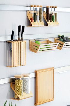 three wooden spice racks mounted to the wall