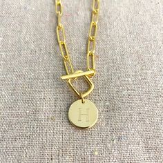 Heatherly Designs basic everyday layering necklace featuring a chunky popular paperclip chain. The necklace closes in the front with a unique toggle clasp in a square shape with a coin charm with your initial of choice. Made from jeweler's brass plated in 14k gold. ●Nickel free ●Padlock initial necklace is sold separately here: https://www.etsy.com/listing/877080160 ●Arrives in our signature Heatherly gift box. Handmade with ❤ by Heather ● ● ● ● ● ● ● ● ● ● ● ● ● ● ● ● ● ● ● ● ● ● ● ● ● ● ● ● →Q Trendy Link Toggle Necklace For Everyday, Minimalist Paperclip Toggle Necklace With Lobster Clasp, Minimalist Paperclip Toggle Necklace With Adjustable Chain, Everyday Paperclip Chain Necklace With Toggle Clasp, Minimalist Everyday Toggle Necklace With Chunky Chain, Minimalist Toggle Necklace With Chunky Chain For Everyday, Everyday Minimalist Toggle Necklace With Chunky Chain, Minimalist Paperclip Chain Necklace With Toggle Clasp, Paperclip Toggle Necklace With Adjustable Chain As Gift